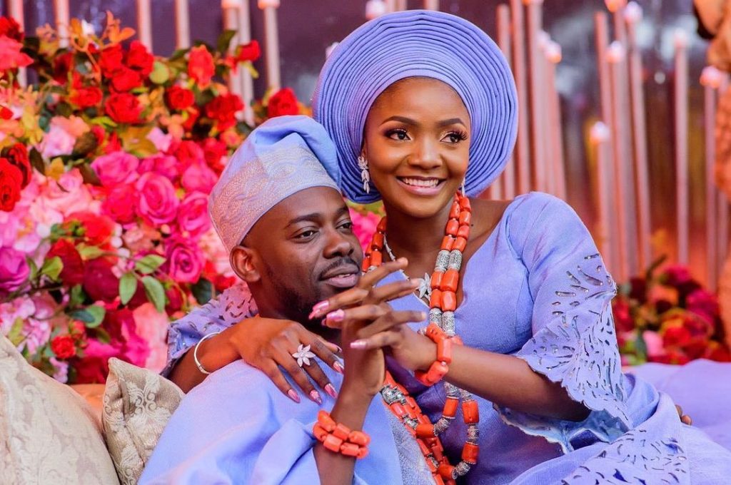 Adekunle Gold Responds to Fan Asking "Who Is Richer Between Him and His Wife, Simi?"